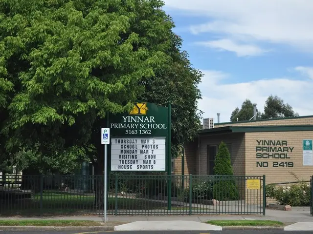 The image shows Yinnar Primary School in Sydney, Australia. It is a building with windows and...