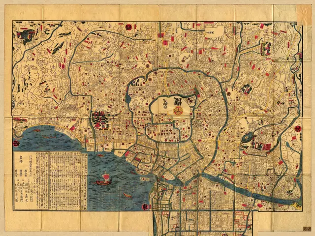 The image shows an old map of the city of Tokyo, Japan, with text written on it. The map is...