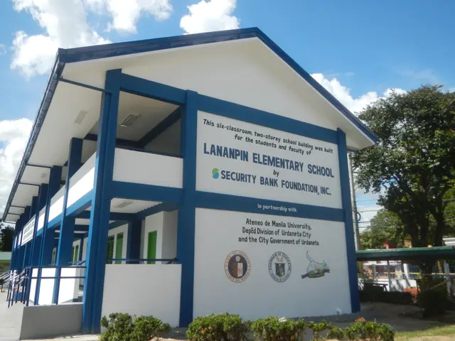 The image shows the Lananpin Elementary School in Manila, Philippines. It is a building with...