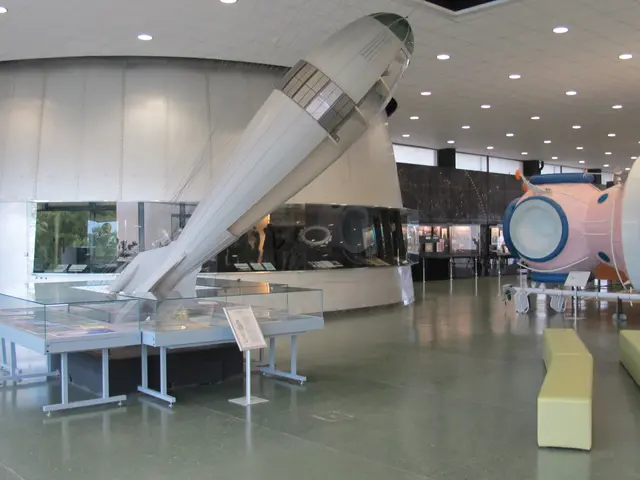 The image shows a large room filled with lots of different types of space equipment, including a...