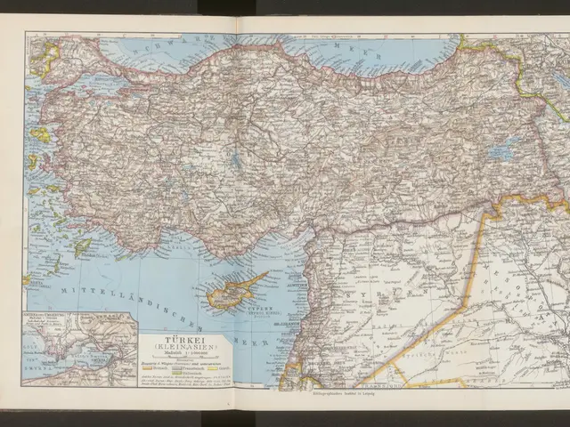 The image shows an open book with a map of Turkey on it, set against a black background. The map is...