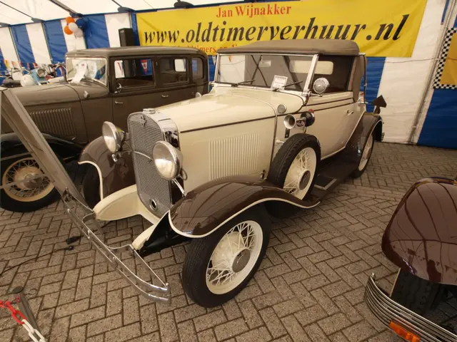 The image shows a vintage car parked in front of a blue and white tent, with a banner attached to...