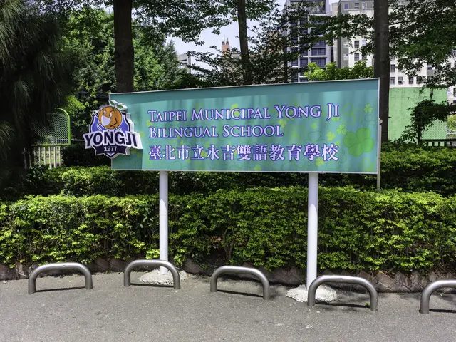 The image shows a board with the text "Taipei Municipal Yong Ji Bilingual School" in the...