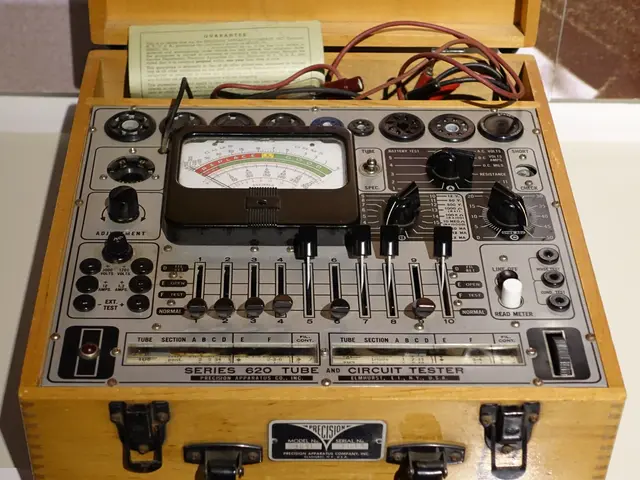 The image shows an old fashioned tester in a wooden case sitting on top of a table. The tester has...